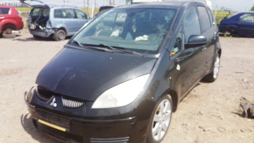 Dezmembram Mitsubishi Colt - 2006 - 1.3i - tip 135.930